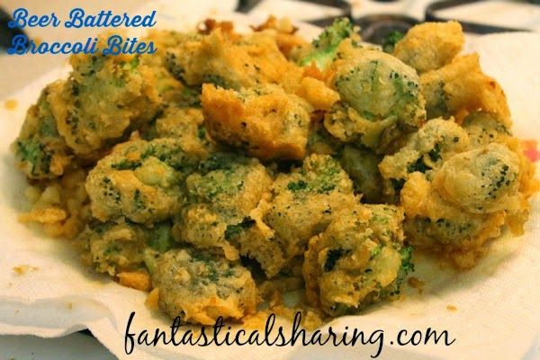 broccoli and cauliflower bites are in a white bowl on a black and white tablecloth