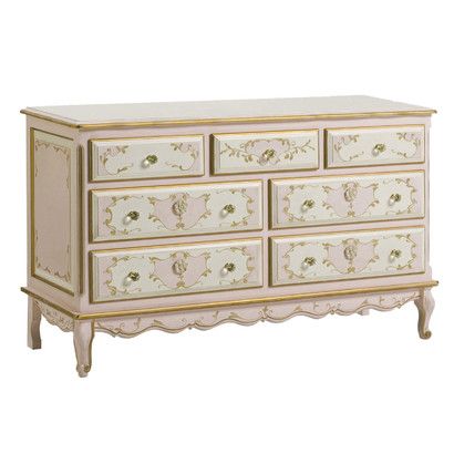 a white and gold dresser with drawers