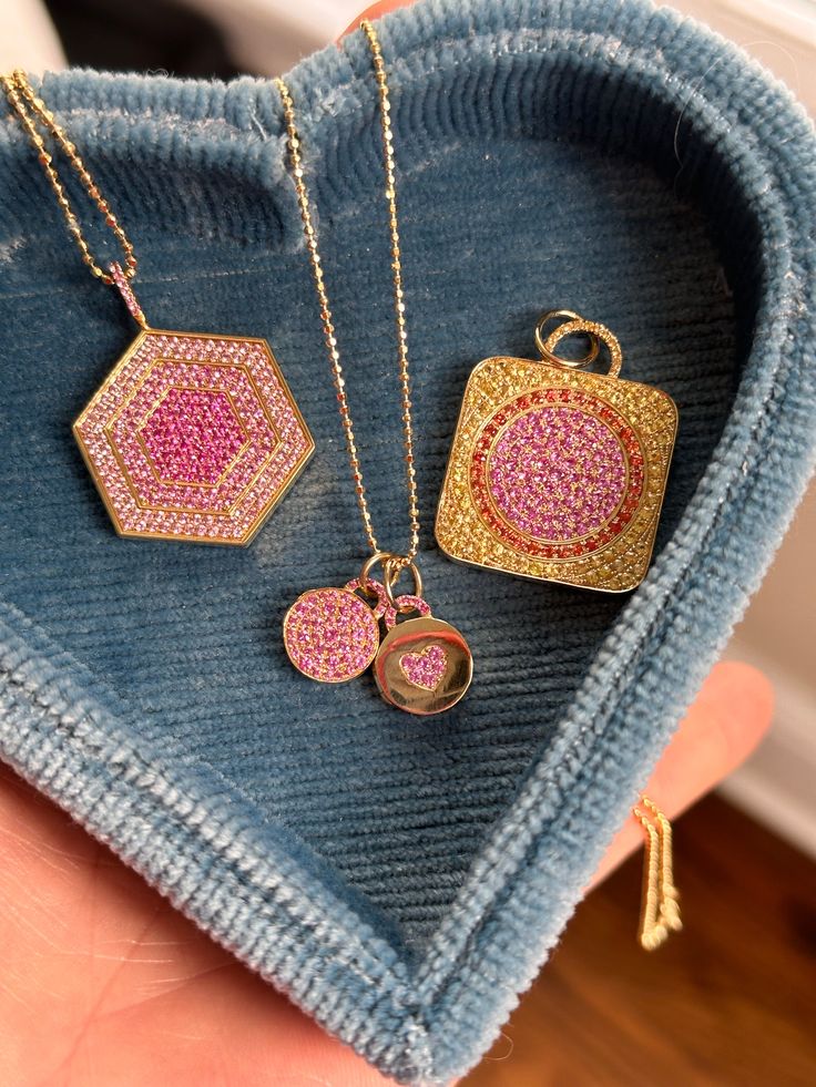 This exquisite bite-sized 'mini' locket necklace in pink sapphire pavé, a deliciously decadent keepsake to hold a treasured photo or a small token of affection. Just like with classic Devon Woodhill lockets, it opens to reveal a small compartment, providing a safe and secure place to hold a cherished photo or a tiny memento. Its compact size and delicate chain make it a versatile accessory, perfect for everyday wear or to be layered with other necklaces for a personalized look. Luxury Cubic Zirconia Necklaces With Charms, Luxury Cubic Zirconia Necklace With Charms, Cubic Zirconia Medallion Necklace Gift, Luxury Heart Pendant Jewelry With Detachable Feature, Luxury Jewelry With Detachable Heart Pendant, Luxury Rectangular Pendant Jewelry For Wedding, Luxury Rectangular Pendant Wedding Jewelry, Diamond Rectangular Pendant Necklace For Gift, Diamond Rectangular Pendant Necklace As Gift