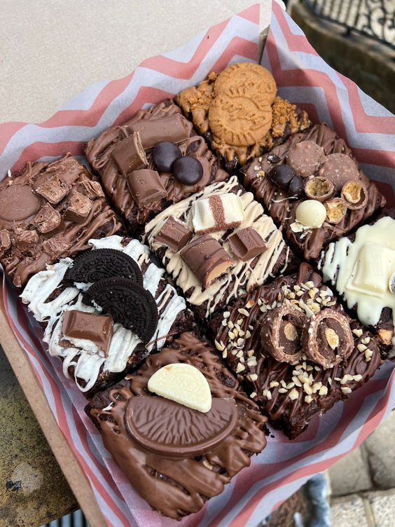 a box filled with lots of different types of cookies