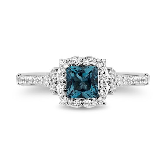 a blue diamond ring with diamonds around it