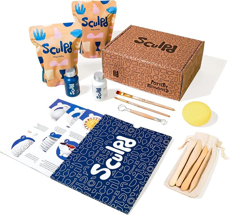 an assortment of crafting supplies including scissors, glue and paper