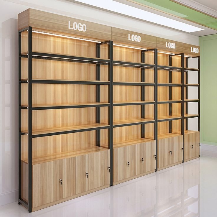 a row of wooden shelves with numbers on each shelf in an empty room that is painted green and white