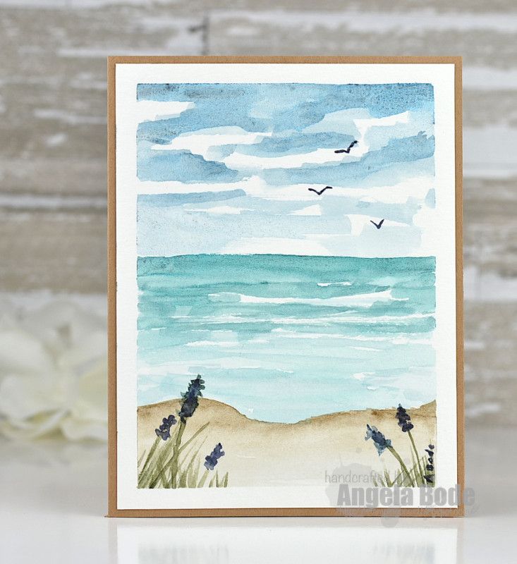 a card with watercolor painting of the beach and seagulls flying in the sky