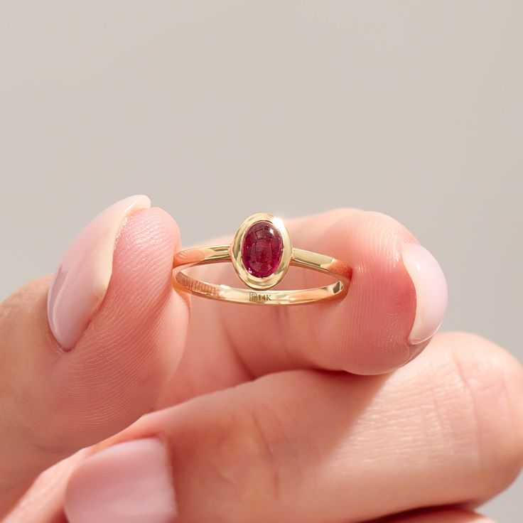 The 14k Solid Gold Red Gemstone Ring is stunning handmade jewelry, perfect for engagements or special occasions. Featuring a vibrant red tourmaline, this bezel-set birthstone solitaire ring is designed for women who appreciate unique and elegant jewelry. Crafted in 14k solid gold, it's a timeless accessory that adds a touch of sophistication to any outfit. Ring Details   ❥ Gold KT: 14k Solid Gold (also in 10, 18K)  ❥ Gold Color Options: White, Yellow, Rose Gold  ❥ Top Width: 8.00x6.20 mm  ❥ Top Fine Jewelry Red Birthstone Stackable Rings, Red Birthstone Stackable Rings Fine Jewelry, Fine Jewelry Garnet Ruby Ring With Bezel Setting, Fine Jewelry Stackable Red Birthstone Ring, Classic Red Ruby Stackable Rings, Red Stackable Birthstone Ring In Fine Jewelry Style, Red Stackable Birthstone Ring, Red 14k Gold Stackable Birthstone Rings, Red Oval Sapphire Birthstone Ring