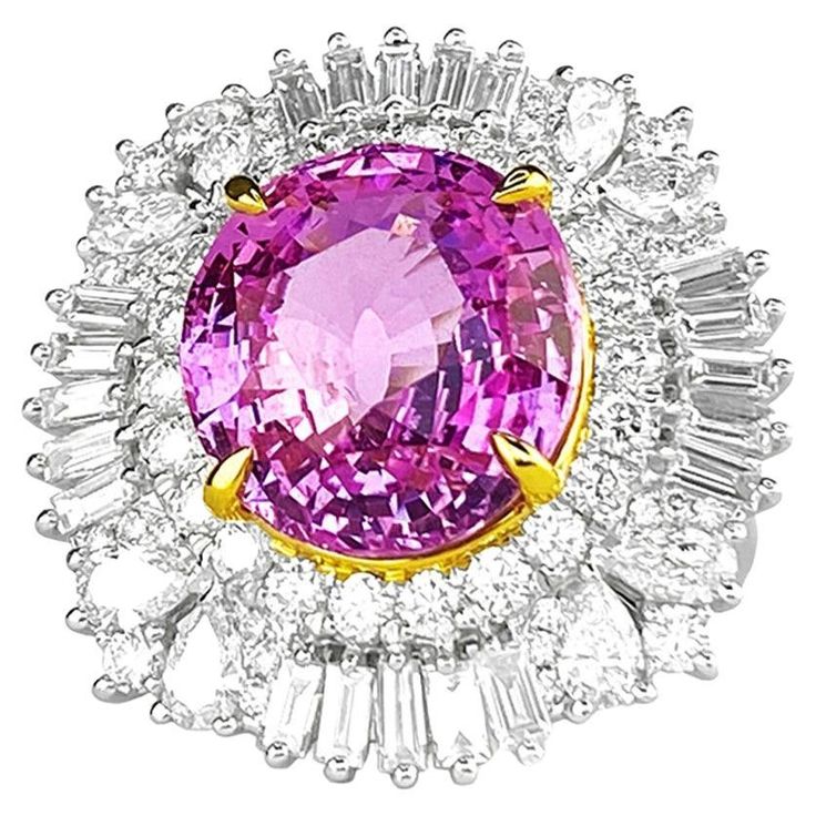 This exquisite "Queen Pink" ring is a true masterpiece of the jewelry world. This stunning piece boasts a remarkable 10-carat natural untreated pink sapphire, one of the world's most precious and rare gems. As the value and desirability of pink sapphire gems have skyrocketed in recent years, the "Queen Pink" ring has become an even more remarkable and coveted treasure. The main feature of the "Queen Pink" gem is a 10.11-carat pink sapphire of exceptional quality, with a vivid pink color and rema Luxury Pink Sapphire Diamond Ring With Gemstone, Luxury Gia Certified Pink Sapphire Diamond Ring, Luxury Pink Ruby Ring With Halo Setting, Luxury Pink Sapphire Ring For Formal Occasions, Luxury Pink Ruby Ring For Formal Occasions, Gia Certified Pink Diamond Ruby Ring, Gia Certified Pink Sapphire Rings For Formal Occasions, Pink Gia Certified Diamond Ring For Formal Occasions, Pink Sapphire Ring With Halo Setting For Formal Occasions