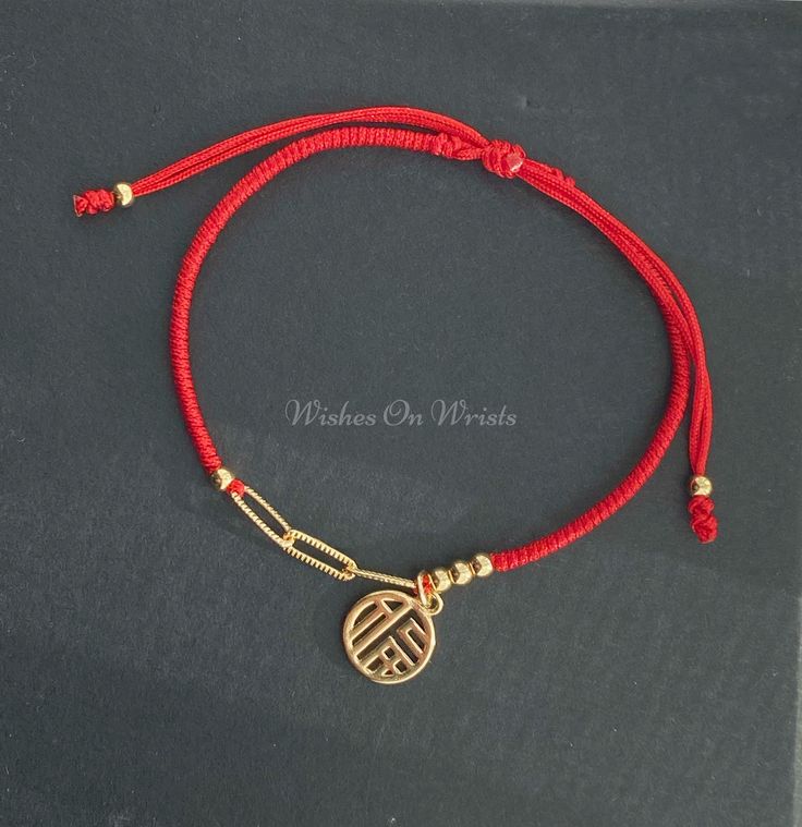 "Red String Bracelet or Anklet with 14k gold plated chain and fortune charm. Red lucky wishes bracelet, bracelet for protection. This bracelet/anklet is simple and elegant. It's perfect for adding a unique sense to any outfit. It is also a wonderful gift for your family or friends.  MATERIALS * 1pc 14k gold-plated Chinese character \"福\" good fortune charm (about 10mm) * 6pcs 14k gold-plated spacer beads (3mm) * 14k gold-plated chain * Nylon thread (professional quality used in Jewelry stores) Your bracelet will arrive in a jewelry box. ❖ The bracelet is made to order, as the bracelet length must be based on your wrist size. The one in the picture is approximately 6.5 inches long. ❖ BRACELET SIZE  We make all our bracelets to actual \"bracelet size\" or \"bracelet length\" (not \"wrist siz New Year Bracelet, Red Bracelet With Adjustable Chain As Gift, Red Bracelet With Adjustable Chain For Gift, Handmade Red Chain Bracelet As Gift, Handmade Red Chain Bracelet Gift, Handmade Red Chain Bracelet For Gift, Red Jubilee Bracelet Jewelry Gift, Handmade Adjustable Red Chain Bracelet, Red Symbolic Bracelet Jewelry