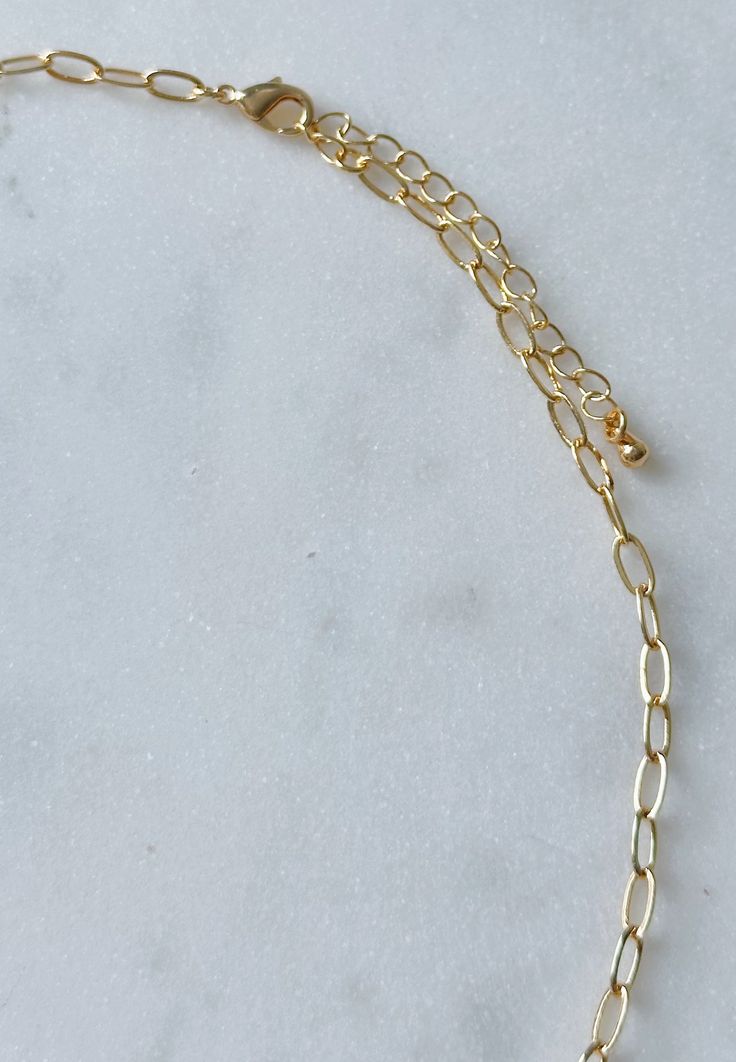 This dainty gold paperclip chain necklace is the perfect everyday accessory and can be effortlessly layered with other necklaces. Necklace is 16 inches long with a 2 inch extender. 14k Gold Filled Chain Link Necklace With Adjustable Chain, 14k Gold-filled Oval Link Necklaces, Everyday 14k Gold Filled Paperclip Chain Necklace, Simple Everyday Paperclip Chain Necklace, Minimalist Gold Paperclip Bracelet With Lobster Clasp, Gold Plated Charm Necklaces With Paperclip Chain, Gold Paperclip Bracelet With Cable Chain, Minimalist Choker Chain Necklace With Lobster Clasp, Minimalist Charm Necklaces With Lobster Clasp For Everyday