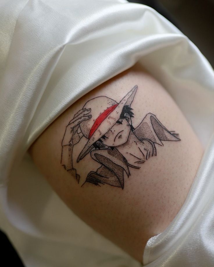 a woman's arm with a tattoo on it that has a girl holding a knife