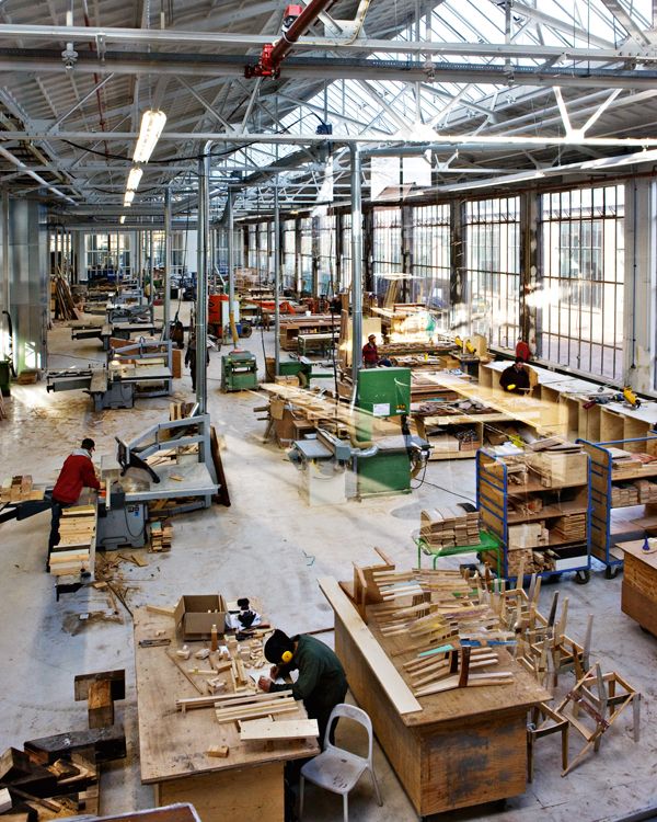 the inside of an industrial building with lots of wood