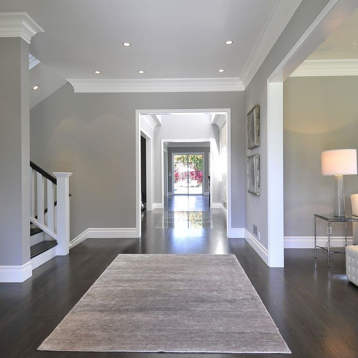 the hallway is clean and ready to be used as a living room or dining area