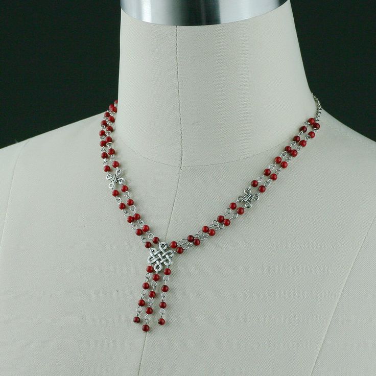 This double stand necklace is handmade using coral; Coral red, a powerful and bold color that captures the viewer's attention. One's eye will always gravitate to where the red is. The length of the necklace is 20-23 inches, or 50-58 cm. It is well suited to crew and high necklines, but can equally add a frame to a plunging neckline. This length looks great with a tailored jacket. The V-shape lariat elongates our neckline and siphones attention to our face. It is easy to wear, it is comfortable t Red Dangle Necklaces For Party, Red Beaded Necklaces For Gifts, Red Beaded Necklaces As A Gift, Elegant Red Lariat Necklaces, Red Long Necklace For Party, Red Beaded Necklace For Valentine's Day Gift, Handmade Red Necklaces For Valentine's Day, Elegant Red Lariat Necklace, Red Bridal Necklace For Party