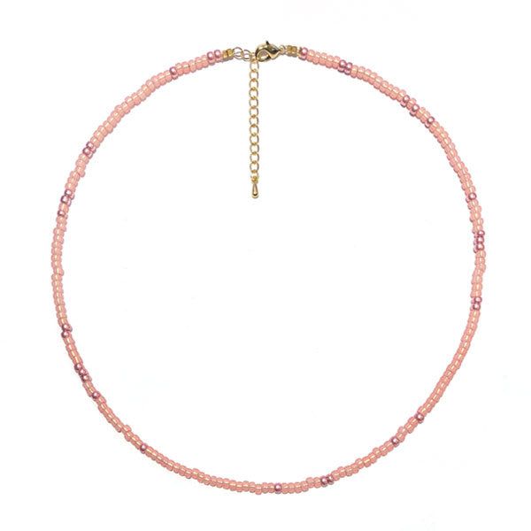 Short beaded necklace strung with our newest soft shiny pink Miyuki seed beads. What's really handy: you can easily slide our gold-plated charms over it! This way you can wear the necklace that matches your outfit every day.

 Colors: soft shiny pink with gold
 Material: glass and gold-plated with E-coating
 Length: adjustable from 38-43cm
 Would you like to make this necklace yourself? These are the materials you need: Miyuki seed beads , gold plated extension clasp , crimp beads and metal wir Dainty Pink Beaded Necklaces For Gifts, Adjustable Rose Gold Necklace With Round Beads, Dainty Pink Beaded Necklace For Gift, Pink Beaded Charm Necklaces With Round Beads, Pink Beaded Charm Necklace With Round Beads, Trendy Pink Tiny Beads Choker, Trendy Pink Choker With Round Beads, Pink Beaded Necklace With Tiny Beads For Gift, Trendy Pink Choker With Tiny Beads