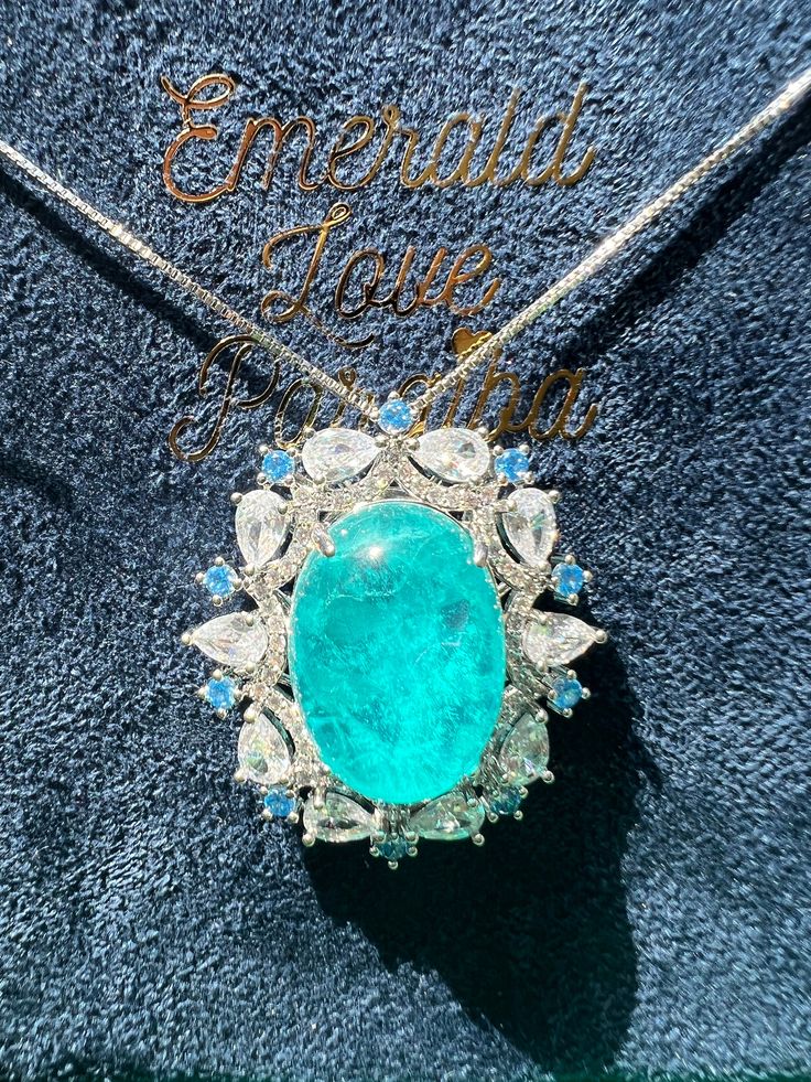 Cabochon Blue Pendant Luxury Halo Paraiba TOURMALINE, Magnificent Exotic Ocean Vivid Blue Pendant w 18KGP ♥Ready to ship ♥ The main stone is the Finest Doublet Stone. ♥Absolutely gorgeous and beautifully handcrafted Finest Doublet PARAIBA Blue Stone in an exquisite setting. ♥ This classic yet trendy Jewelry makes the perfect Christmas/Anniversary/Valentine's/Birthday gift for her that will be treasured forever. We have confidence that the beautiful and sparkling piece will get her deeply moved a Luxury Fine Jewelry Cabochons As Gift, Luxury Aquamarine Exquisite Jewelry, Luxury Blue Cabochons For Gift, Luxury Cabochon Fine Jewelry Necklaces, Luxury Blue Cabochons As Gift, Luxury Halo Setting Necklace For Anniversary, Exquisite Luxury Tourmaline Jewelry, Luxury Blue Necklace With Pave Setting, Luxury Blue Pendant Gemstones