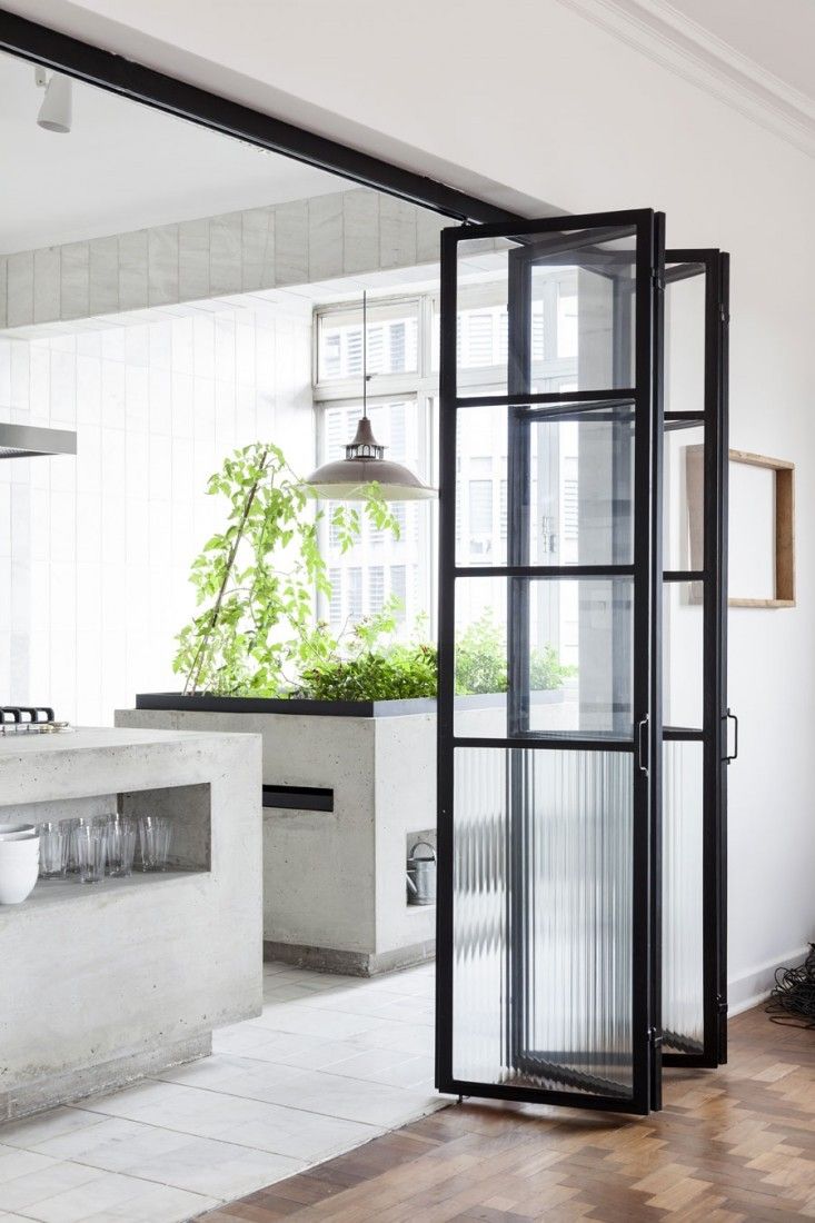 an image of a room with french doors on the front and back side, in white