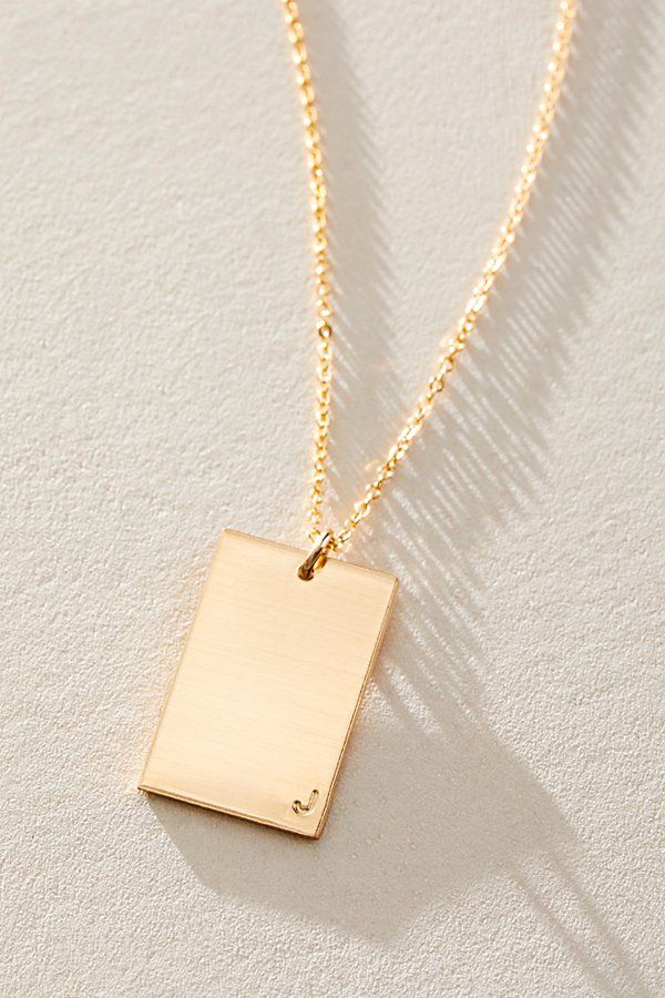 So unique in an understated design, this stunning necklace features a personalized rectangle pendant with initial engraved at corner for a super fun finishing touch. * 14k Gold Filled * 0.5x0.75" rectangle bar necklace with hand-stamped personalization * Length: 20" * 5 days of production | Set & Stones Personalized ie Necklace at Free People in Gold Rectangular Yellow Gold Bar Necklace For Everyday, Everyday Yellow Gold Rectangular Bar Necklace, Everyday Rectangular Yellow Gold Bar Necklace, Elegant Rectangular Bar Necklace As Gift, Elegant Rectangular Bar Necklace For Personalized Gift, Elegant Rectangular Bar Necklace For Gift, Elegant Rectangular Bar Necklace Gift, Minimalist Yellow Gold Bar Necklace With Rectangular Pendant, Modern Jewelry With Rectangular Pendant For Gift