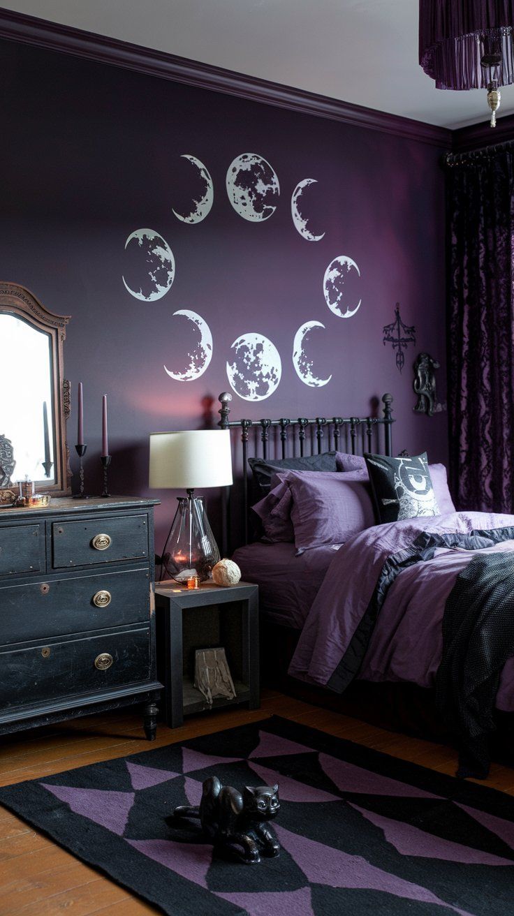 a bedroom decorated in purple and black with moon phases on the wall