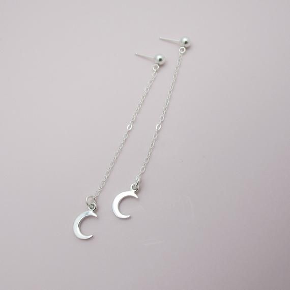 SOLID STERLING SILVER EARRINGSThese celestial earrings make a wonderful gift. The real sterling ear studs are adorned with a tiny moon that dangles elegantly on sterling silver chain. Comes in a gift box, perfect for gift giving. Total earring length is approximately 2 3/4 inches long. ALSO AVAILABLE IN A STAR DESIGN OR MOON/STAR COMBO Minimalist Moon Charm Drop Earrings, Minimalist Moon Shaped Single Earring, Dainty Moon Phase Earrings, Crescent Silver Earrings As Gift, Minimalist Crescent Earrings For Gift, Minimalist Crescent Earrings As Gift, Minimalist Moon Phase Earrings For Gifts, Minimalist Moon Phase Earrings As Gift, Minimalist Hypoallergenic Crescent Earrings