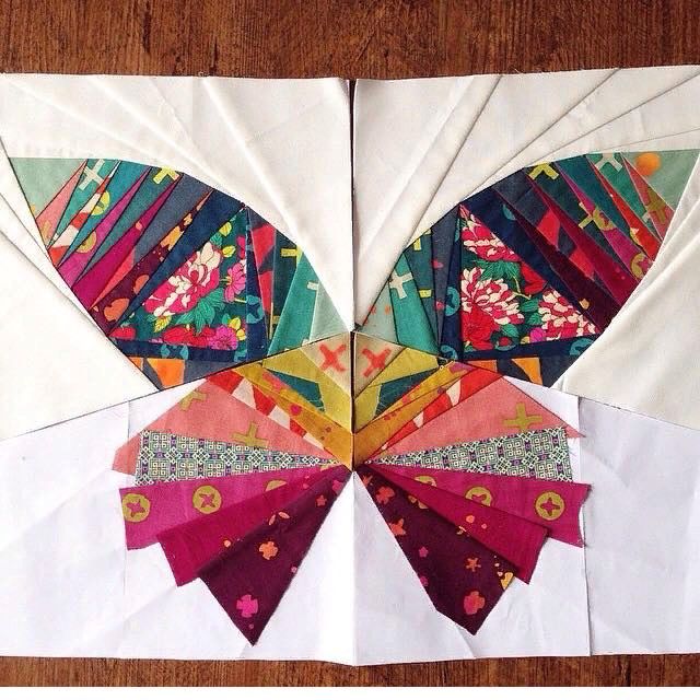 an origami butterfly made out of paper on a table