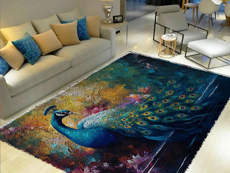 a living room area rug with a peacock painting on the floor and couches in the background