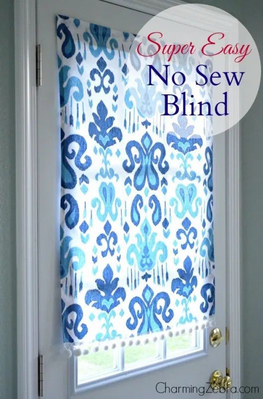 a blue and white patterned window covering