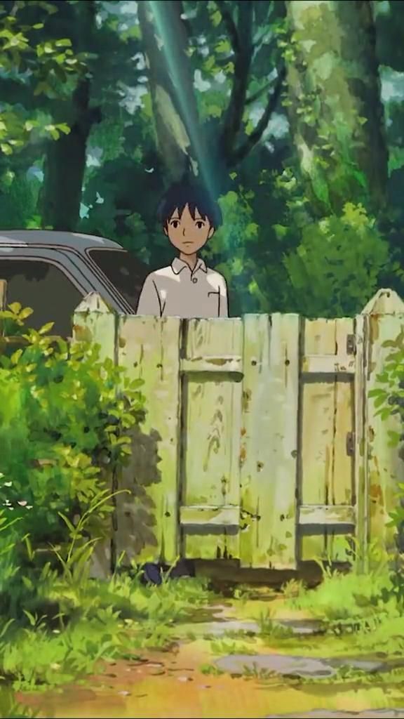 a man standing behind a wooden fence in the woods next to a parked car and trees