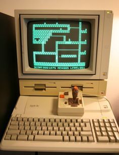 an old computer sitting on top of a desk