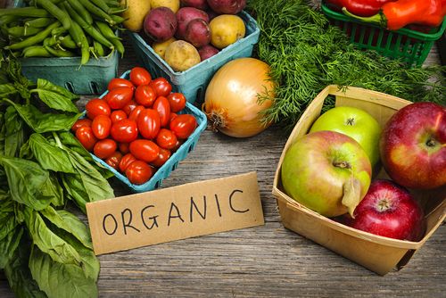 an assortment of fresh produce including tomatoes, green beans and other vegetables