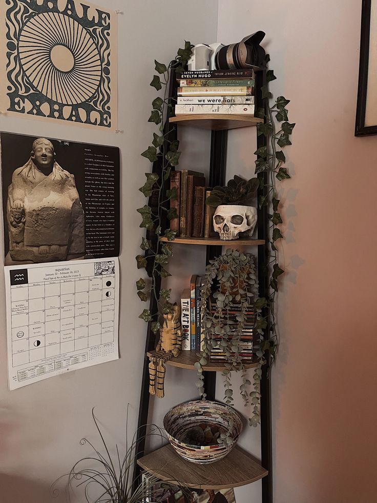 there is a shelf with books on it in the corner next to a wall calendar