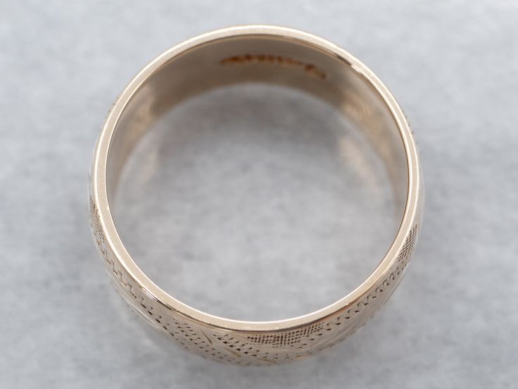 So many wonderful details come together to give this vintage band a rich, textural feel! Crafted of 14 karat yellow gold, this is a great band for stacking or wearing traditional as a wedding band!Metal: 14K Yellow GoldWidth of Band: 8.0 mmHeight off Finger: 1.4 mmRing Size: 6Marks: “<14K>” Stamped on the inside band Band Metal, Pocket Watch Chain, Botanical Pattern, Watch Chain, Vintage Band, Gold Hands, Vintage Botanical, Great Bands, Come Together