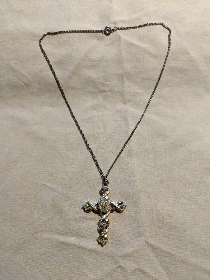 Vintage 1950's Cross w/ jewels and wrapping. Ostentatious enough to be Goth, sure to be noticed at church! 17" chain. Vintage Jewelry With Adjustable Chain For Party, Vintage Party Jewelry With Adjustable Chain, Adjustable Cross-shaped Party Jewelry, Vintage Metal Jewelry With Adjustable Chain, Vintage Silver Necklace With Adjustable Chain, Formal Cross Pendant Chain Necklace, Formal Cross-shaped Metal Jewelry, Formal Cross Pendant Necklace With Chain, Antique Cross Pendant Necklace For Formal Occasions