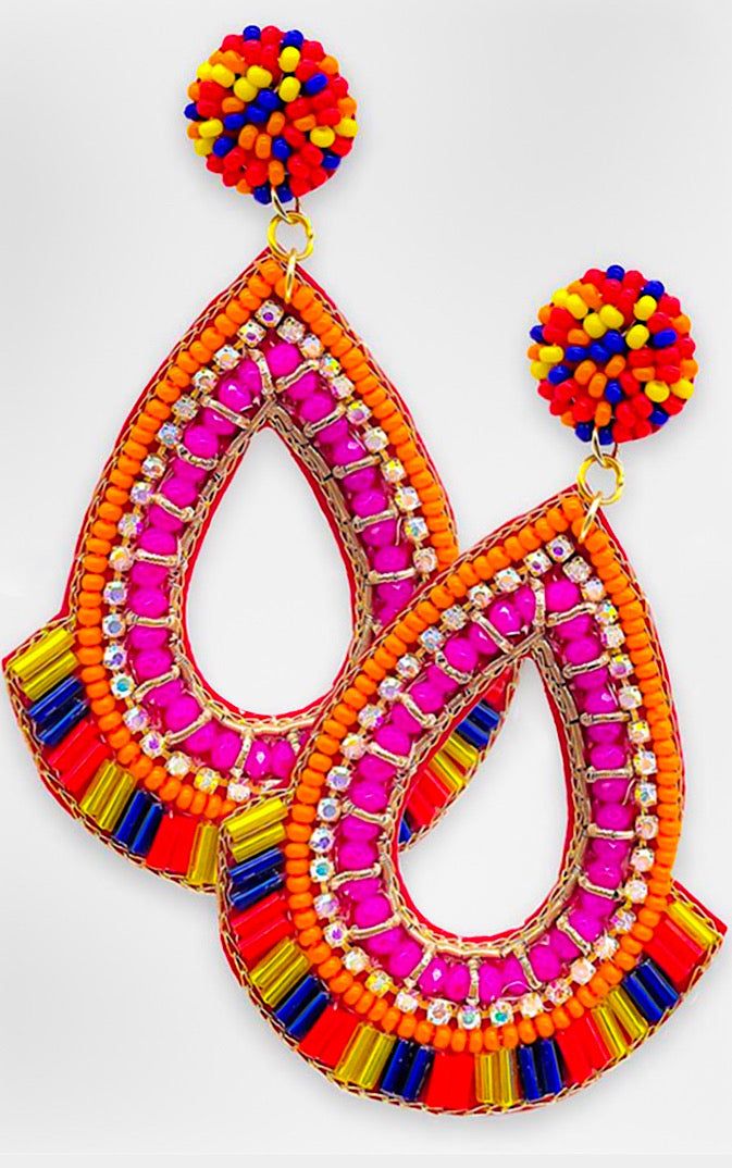 Add a fun vibe to your outfit with these colorful serape beaded earrings! Featuring shades of hot pink, orange, red, blue, and yellow, these gorgeous earrings are so super cute paired with a solid top or tee for a fun spring and summertime look! Approx 3” long, 2” wide FREE SHIPPING over $30! Clear Spring, Seed Bead Earrings, Bead Earrings, Solid Tops, Color Of Life, Blue And Yellow, Gorgeous Earrings, Seed Bead, Pink Orange