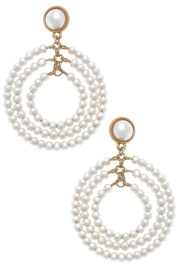 Make a statement on your Big Day with these stunningly sophisticated Ivy Pearl Drop Hoop Earrings in Ivory! Perfect for the modern bride, these elegant earrings will be an unforgettable addition to your look – just like the love of your life! Have all eyes on you for the best reasons. DETAILS: Base Metal with Worn Gold Plating Glass Pearls Post Back Closure 2.625" Length x 1.5" Width Chic Pearl Drop Clip-on Earrings For Wedding, Chic Cream Jewelry For Formal Occasions, Chic Cream Jewelry For Formal Events, Chic Cream Formal Jewelry, Chic Round Clip-on Earrings For Weddings, White Hoop Earrings For Evening, Elegant White Clip-on Chandelier Earrings, Classic White Chandelier Earrings For Party, Elegant Hoop Clip-on Earrings