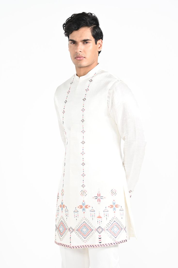 Ivory Phulkari inspired Nehru Jacket with pipe, cutdaana and thread work embroidery with same coloured kurta with embroidery detail on the chest and sleeve. this set in made in linen Satin, Paired with Ivory slim fit Pant Pajama. Color of
the actual garment may vary due to lighting conditions during the shoot.

Size Chart For Men





	
	
					Men's Size Chart
		

		
		
						
				Size Chart For Men
				Custom Size Measurement Guide
			
			
				
				
				Custom Size Measurement Guide
1. Take you Embroidered Bandhgala In Chanderi Fabric, Designer Floral Embroidery Kurta For Transitional Season, Designer Floral Embroidered Kurta For Transitional Season, Chanderi Kurta With Embroidered Long Sleeves, Unstitched Kurta With Embroidered Sleeves For Navratri, Designer Straight Kurta In Off White, Cotton Nehru Jacket With Floral Embroidery, Anarkali Salwar Kameez With Embroidered Sleeves For Festivals, Traditional Drape Kurta With Floral Embroidery For Eid