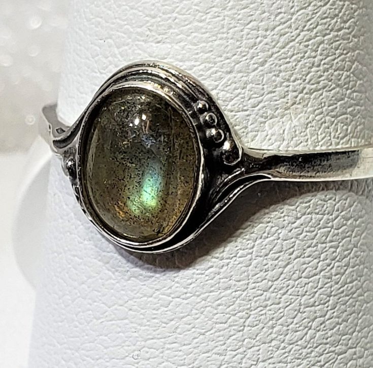 Magical Natural labradorite silver 925 mark ring szs 4-12 cabochon stone size 6 x 8 mm gift box included A semi-precious stone is also known as a gem or gemstone (also a jewel, a gem, a precious stone), which is a portion of mineral, which, in refined and cut form, is used to create jewelry or other embellishments. There are also organic resources or precise rocks that are not minerals (for example jet or amber) that are also used for jewelry and would also be considered to be gemstones, as well Silver Cabochon Rings Fine Jewelry, Silver Stackable Rings With Gemstone, Elegant Adjustable Labradorite Ring, Silver Jewelry With Round Gemstone, Adjustable Cabochon Round Stone Jewelry, Silver Stackable Rings With Round Gemstones, Silver Moonstone Ring Fine Jewelry For Gift, Vintage Oval Cabochon Moonstone Jewelry, Labradorite Jewelry With Bezel Setting As Gift