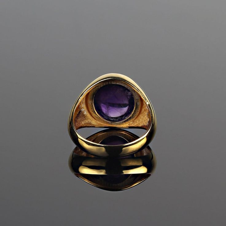 This is part of Chairish’s Fine Jewelry assortment.  Elegant 8.28ct Oval Amethyst Cabochon Ring in Gold Rhodium over Sterling Silver  Add timeless sophistication to your jewelry collection with this 8.28-carat oval Amethyst cabochon ring, elegantly set in a custom gold rhodium-plated bezel over sterling silver. This versatile piece is designed to complement both daily wear and evening ensembles, making it a go-to accessory for any occasion.  Key Features Stunning Amethyst Gemstone: The oval cabo Fine Jewelry Oval Amethyst Gemstone Ring, Luxury Cabochon Signet Ring For Formal Occasions, Timeless Polished Amethyst Ring For Formal Occasions, Oval Cabochon Signet Ring For Formal Events, Oval Cabochon Signet Ring For Formal Occasions, Fine Jewelry Oval Cabochon Signet Ring For Formal Wear, Fine Jewelry Oval Cabochon Signet Ring For Formal Occasions, Formal Amethyst Rings With Bezel Setting, Luxury Oval Cabochon Signet Ring For Anniversary