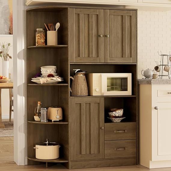 a kitchen with a microwave and cabinets in it