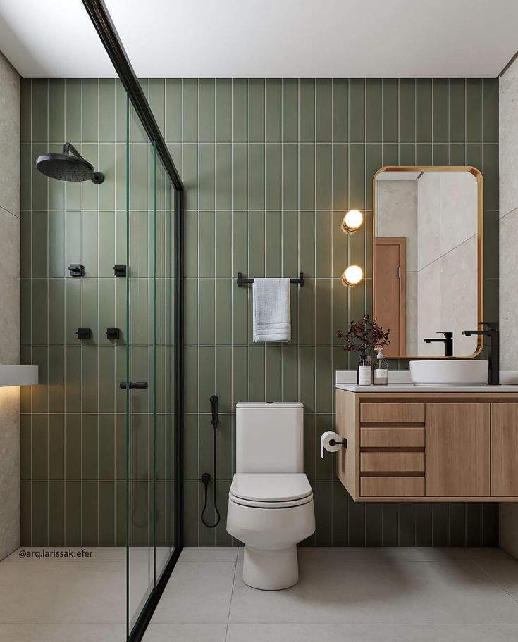 a bathroom with a toilet, sink and shower stall in it's own area