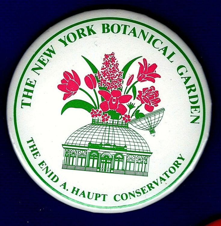 the new york botanical garden logo on a white and green plate with red flowers in it