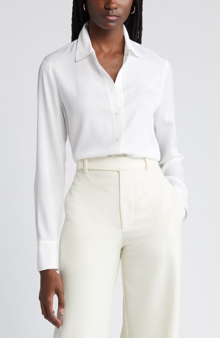 This versatile button-up blouse is irresistibly updated in luxe stretch silk with easy-moving back pleats and a tuckable high/low hem. 27" length (size Medium) Front button closure Spread collar Long sleeves with single-button cuffs Back yoke with box pleat 92% silk, 8% spandex Dry clean or hand wash, line dry Imported Individualist Tailored Elegant Blouse For Business Casual, Elegant Tailored Blouse For Business Casual, Elegant Workwear Blouse With Hidden Button Closure, Elegant Office Blouse With Hidden Button Closure, Elegant Office Wear Blouse With Hidden Button Closure, Elegant Blouse With Hidden Button Closure For Office, Elegant Tailored Tops With Concealed Placket, Elegant Silk Tops For Business Casual, Elegant Silk Top With Hidden Button Closure