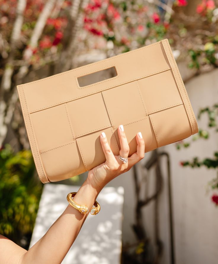 Whether you're attending a wedding, enjoying a night out, or planning your next getaway, the Remy Clutch is perfectly sized to carry all your essentials while effortlessly complementing any look. Handcrafted from luxurious smooth Italian calfskin leather, this versatile handbag has a cutout handle detail and a hidden magnetic closure for added style and convenience. Its minimalist design exudes sophistication, making it a must-have addition to your accessory collection this season. Italian Calfskin Leather Hidden magnetic closure Handcrafted Size: 13” W x 8” H x 2” D Weight: 1 lb Desk Stationery, Leather Decor, Best Wallet, Leather Hide, Wallet Bag, Frame Shop, Small Leather Goods, Leather Accessories, Bag Straps