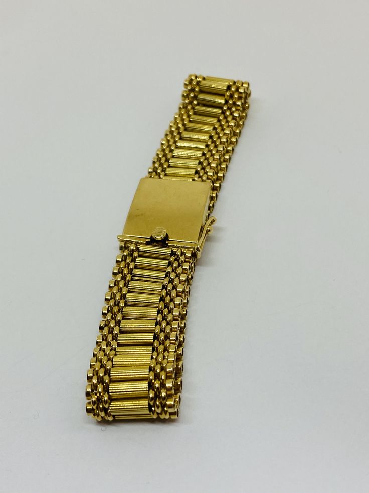 "This is a beautiful, vintage 14K yellow gold bracelet. Material(s) 14K yellow gold Measurements: This bracelet measures 7 inches in length and 14.3 millimeters in width. Weight: 24.6 grams Markings: \"14K\" If you have any questions about this bracelet, please do not hesitate to contact us! ♥" Antique Gold Bracelet Stamped 14k, Antique 14k Stamped Gold Bracelet, Classic Gold Band Bracelet, Vintage 14k Gold Bracelet For Anniversary, Vintage Yellow Gold Bracelets Stamped 14k, Gold Jubilee Bracelet Band, Vintage Gold Bracelet Hallmarked, Vintage 14k Gold Bracelets, Vintage Hallmarked Gold Bracelet