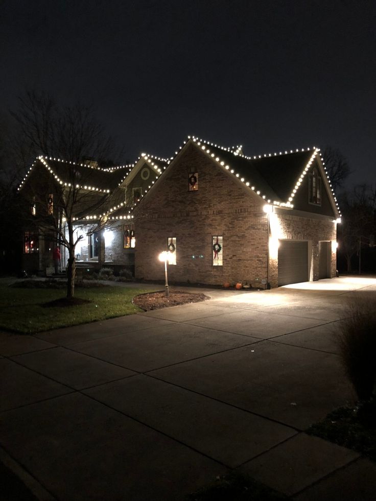 a house is lit up with christmas lights