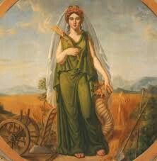 a painting of a woman in a green dress holding a bird and standing next to a wheel