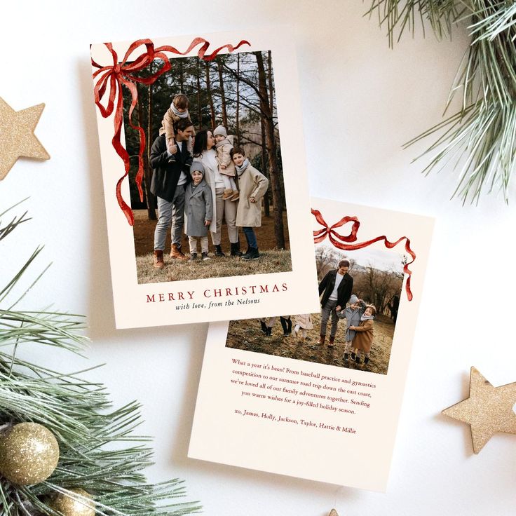 two christmas cards with the words merry christmas on them next to evergreen branches and gold stars