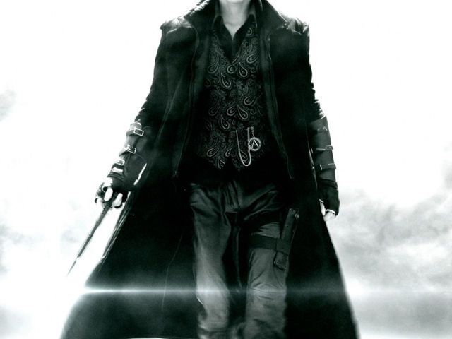 a man dressed in all black walking down the street with two swords on his shoulder