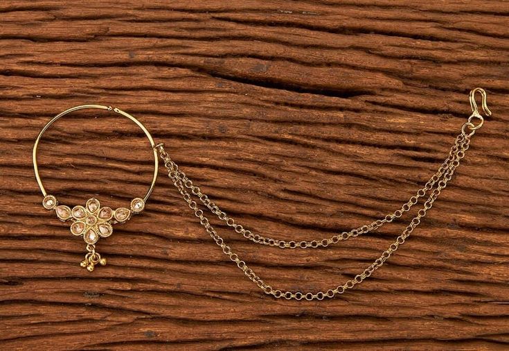 three different types of jewelry sitting on top of a wooden table