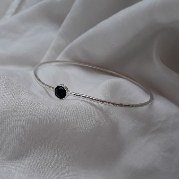 "Modern and simple Wave Hammered bangle for women. 2mm. Sterling silver wire stacking bangle is perfect in its simplicity. Gemstone bangle modern and trendy look. Summer jewelry, graduation gift. 6mm. Onyx stone set in a decorated stone house. Layering bracelet, Everyday bracelet. Very important! to avoid mistakes, please make sure you have the right size. If you not sure then look at item photos and learn how to do it. x-small - 2.25\" diameter 7.5\"circumference small - 2.5\" diameter 8\"circu Nickel Free Minimalist Round Bangle, Minimalist Stackable Cuff Bangle Bracelet, Minimalist Bangle Bracelet With Simple Design, Minimalist Nickel Free Bangle Bracelets, Minimalist Stackable Bangle As Gift, Minimalist Stackable Round Bangle, Minimalist Sterling Silver Stackable Bracelet, Simple Bangle Bracelets As Gifts, Simple Silver Bangle Jewelry