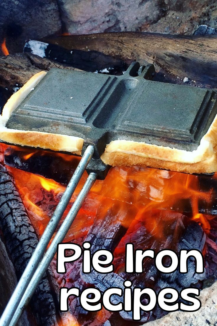 there is a piece of bread cooking on an open fire with the words pie iron recipes over it