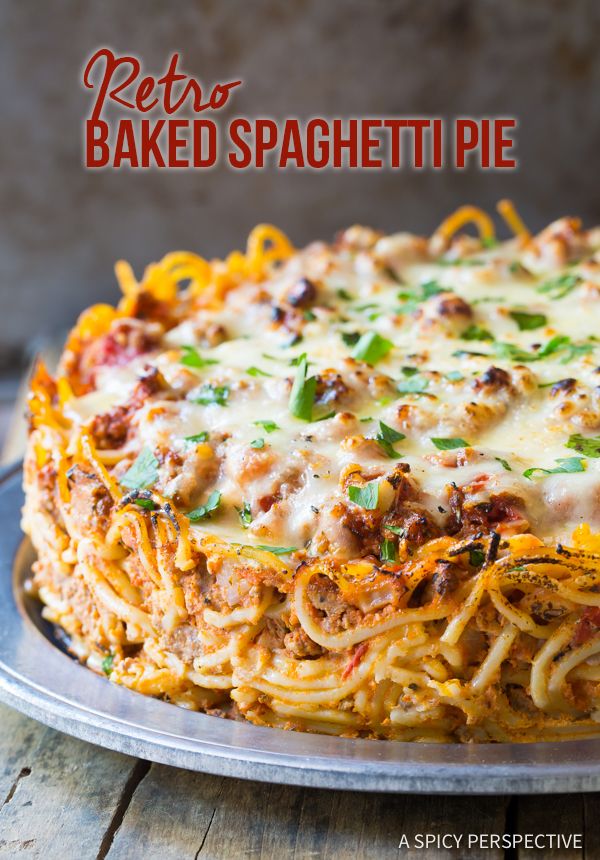 a baked spaghetti pie on a plate with the words retro baked spaghetti pie above it